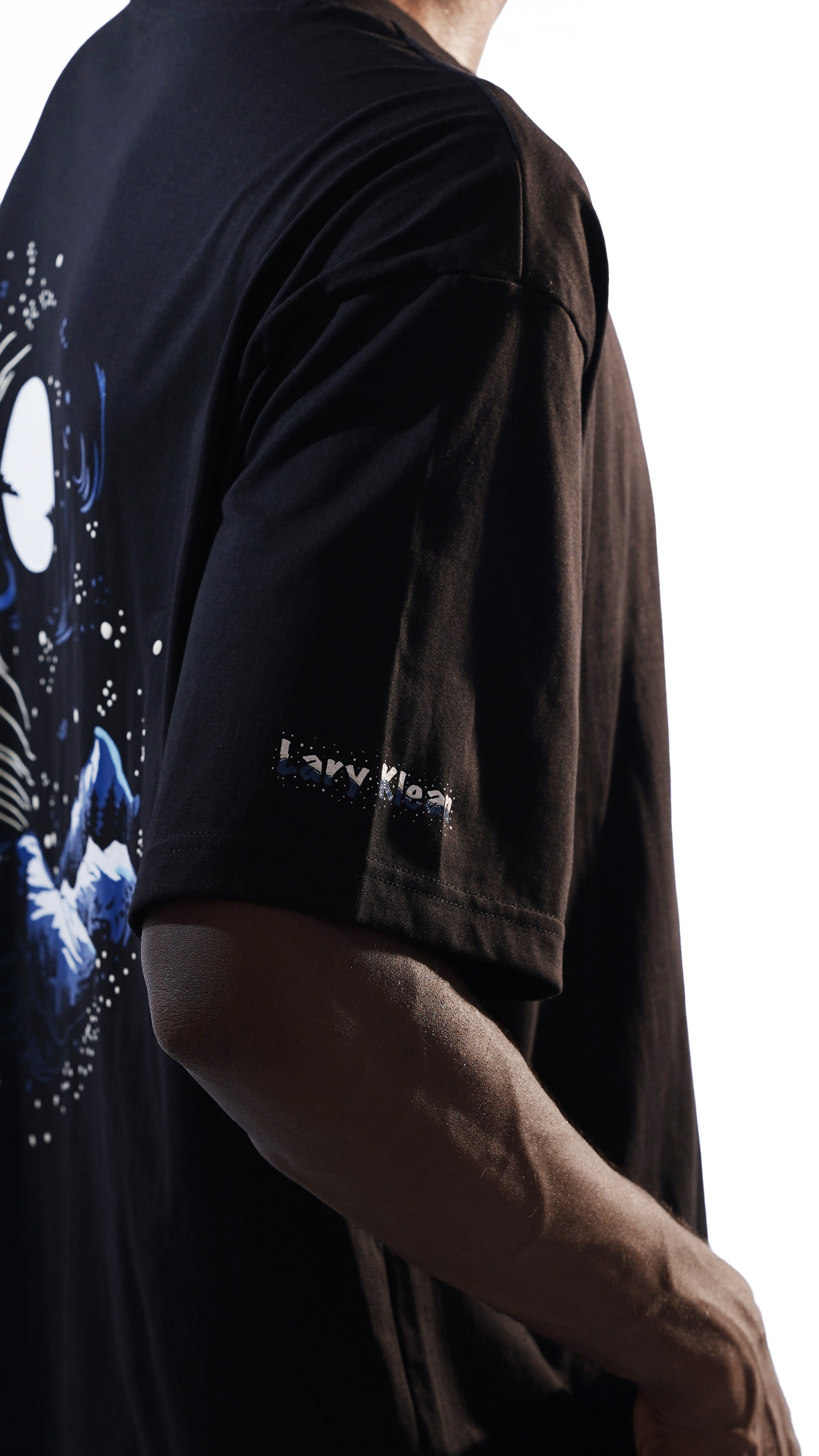 The Celestial Tee features stunning night sky designs with majestic mountains on the back, capturing the serene beauty of starry nights and rugged peaks. Perfect for nature lovers and stargazers, available at Cop Underdog In-store and ready to ship.