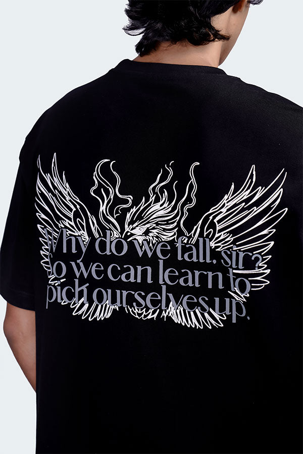 This Black Tee is inspired by the timeless wisdom: “Why do we fall, sir? So we can learn to pick ourselves up.” , available at Cop Underdog In-store and ready to ship.