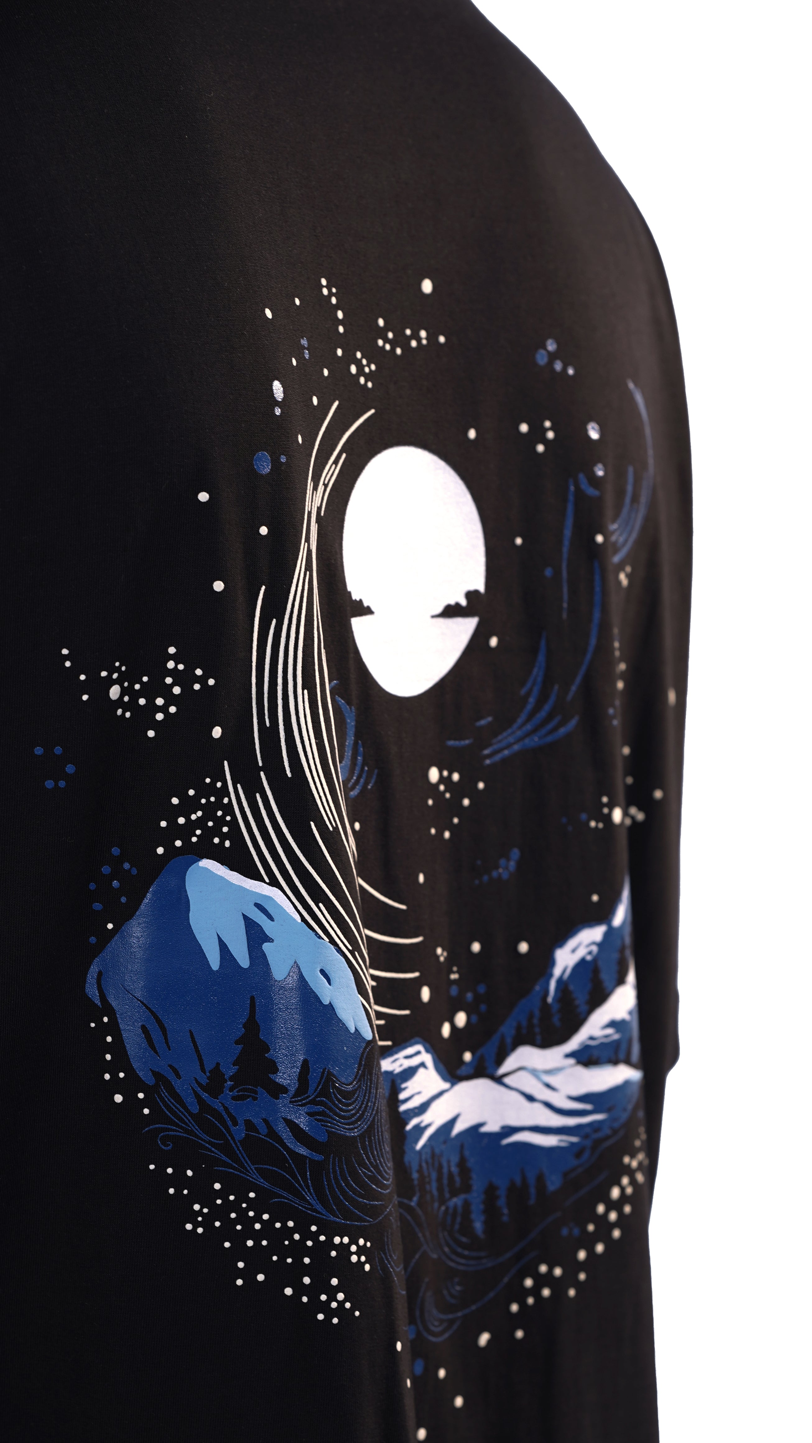The Celestial Tee features stunning night sky designs with majestic mountains on the back, capturing the serene beauty of starry nights and rugged peaks. Perfect for nature lovers and stargazers, available at Cop Underdog In-store and ready to ship.
