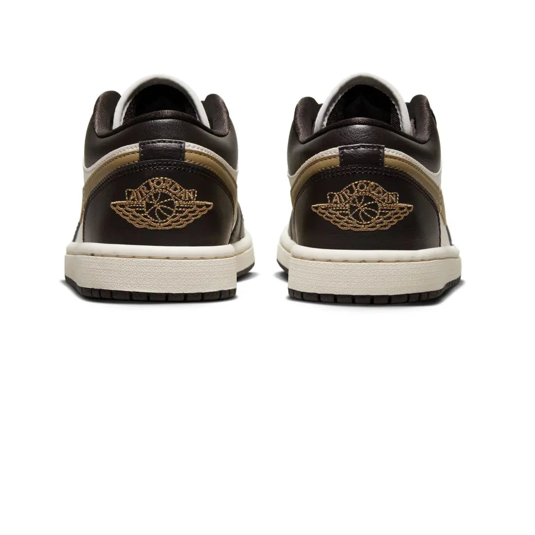 The Jordan 1 Low Shadow Brown (W) is a women’s-exclusive colorway of the retro basketball shoe with a casual appearance. The "Shadow Brown" has a Sail leather base with overlays made of black leather, available at Cop Underdog In-store and ready to ship.