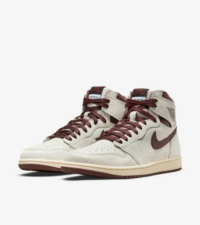 The Jordan 1 Retro High OG A Ma Maniére (White and Brown) is constructed of superior cracked leather with burgundy reptilian-textural leather collars and Swooshes. A luxurious quilted inside and unique woven tongue and insole labels alongside a vintage-looking yellowed sole completes the look at the bottom Air Jordan 1, available at Cop Underdog In-store and ready to ship.